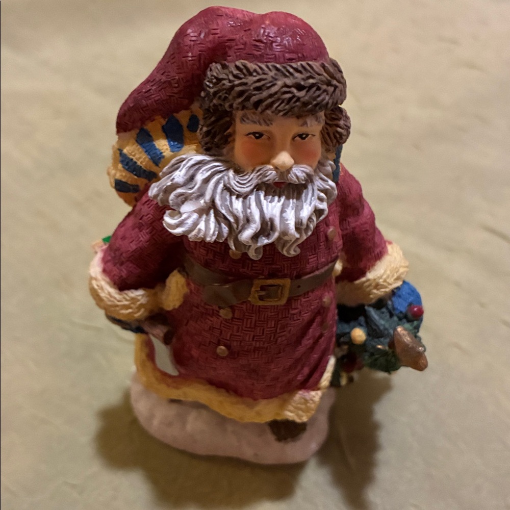 Santa figurine- Canada-there is 1 tiny spot on eyebrow that is missing paint.